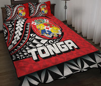 Red Polynesian-style quilt bed set with bold white lettering and crest, plus two matching pillows