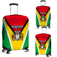 Guyana flag luggage cover on two suitcases, red/yellow/green diagonal stripes and crest
