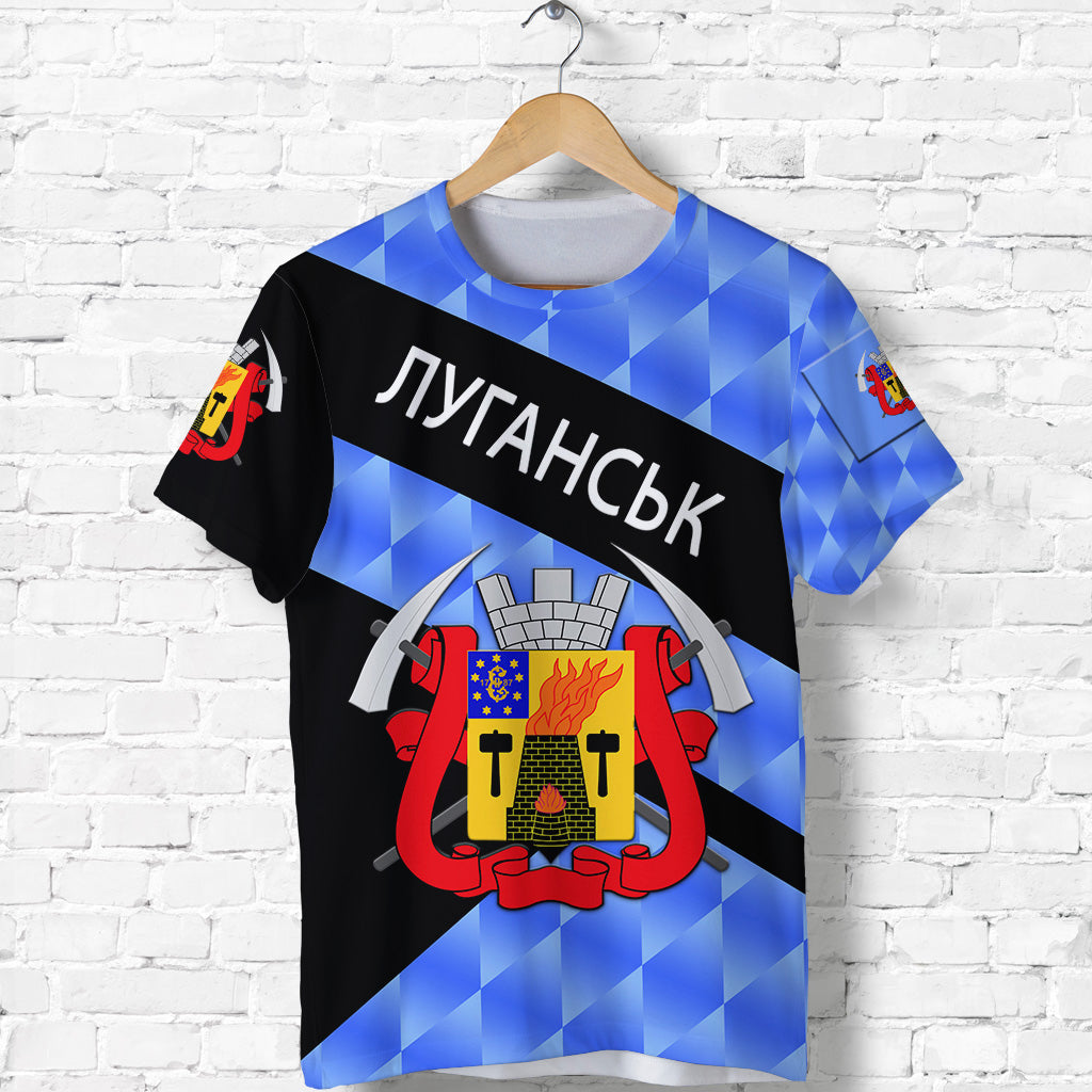 Blue geometric sporty T‑shirt with black diagonal band and crest graphic