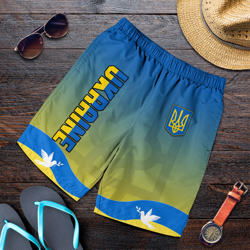 Men's Ukraine flag shorts with 'UKRAINE' text and trident logo, blue-yellow gradient