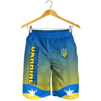 Hanging men's Ukraine flag shorts with 'UKRAINE' text, trident emblem, blue-yellow print
