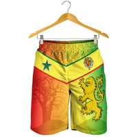 Hanging men’s Senegal shorts with star and lion crest on yellow-green body