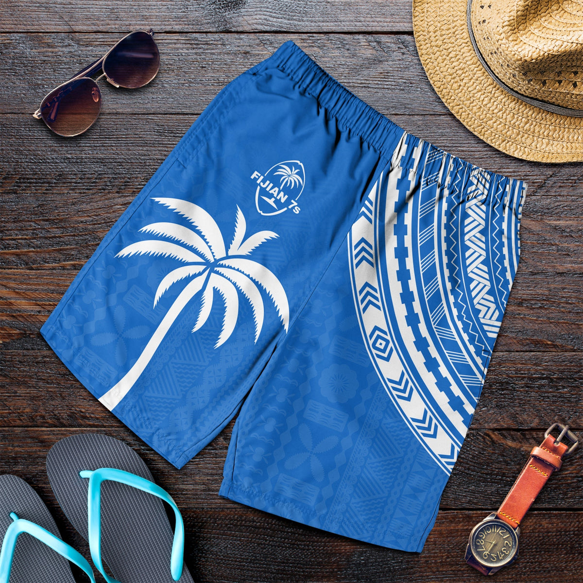 Blue rugby sevens shorts with white tribal pattern and elastic waistband