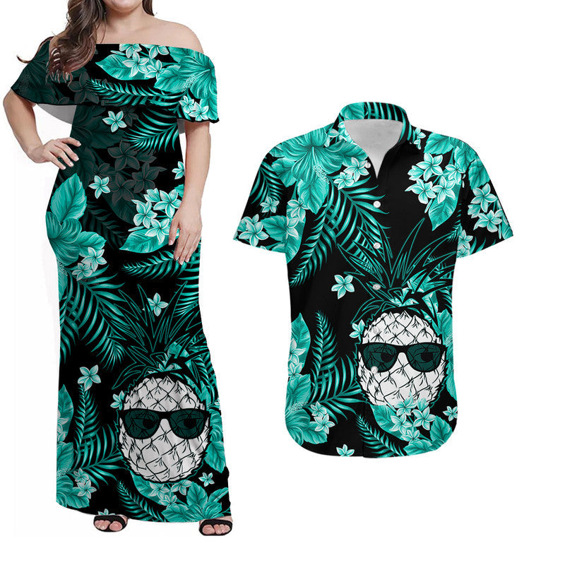Off-shoulder maxi Hawaiian dress, dark base with teal tropical leaf print and face graphic