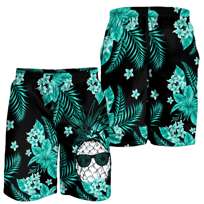 Men's tropical swim shorts, black with turquoise leaves and flower print.