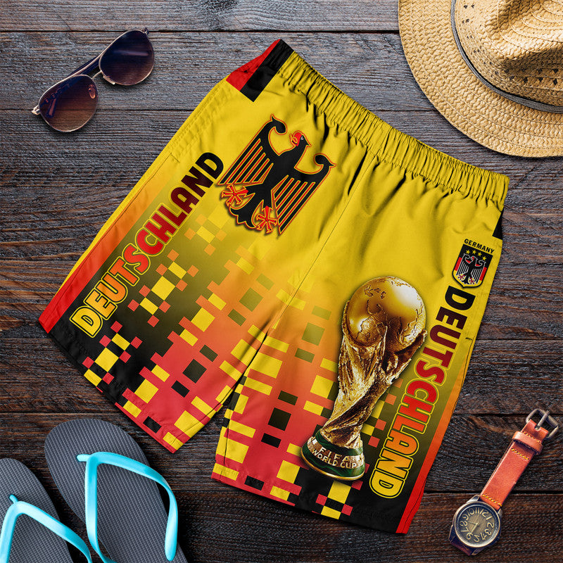 Men's yellow graphic football shorts with elastic waistband and side stripe