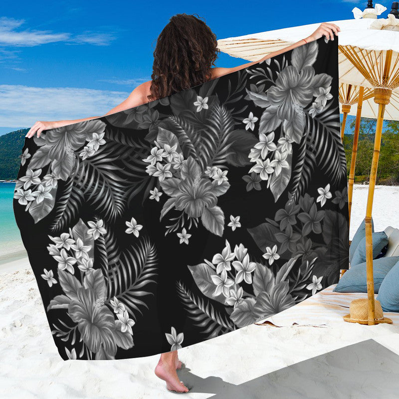 Dark gray floral sarong with palm and hibiscus-like blossoms, lightweight wrap.