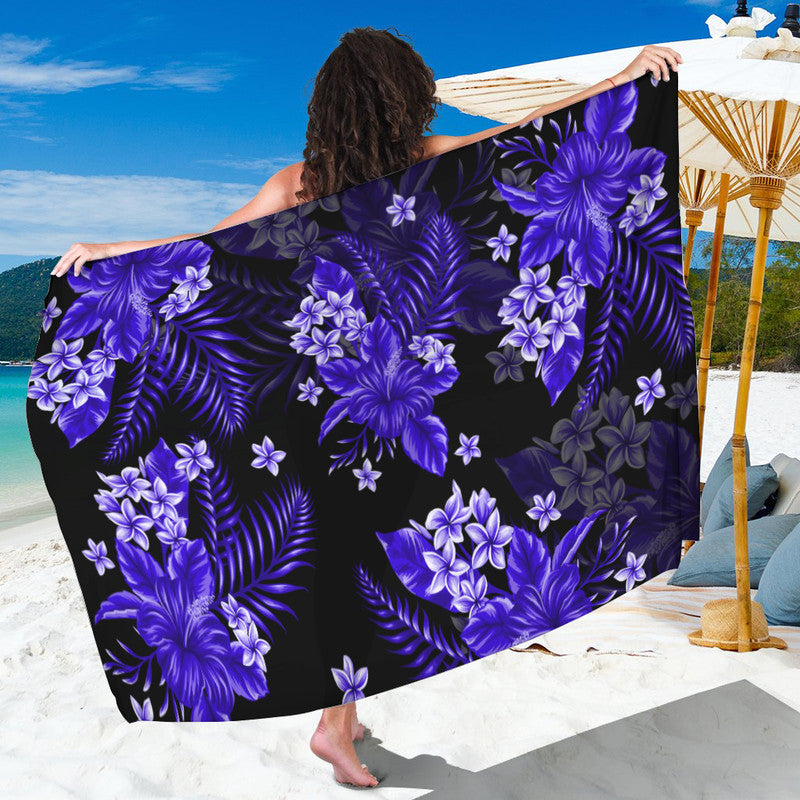 Dark blue sarong with purple floral and leaf pattern, held for draping