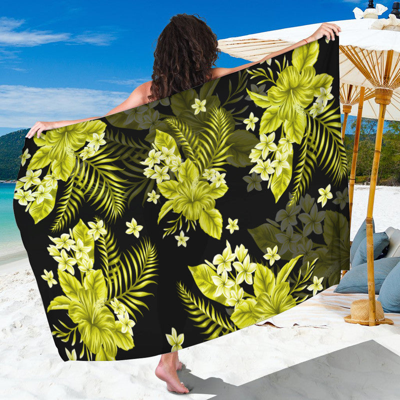Yellow floral sarong with lime green leaves and blossoms on dark background