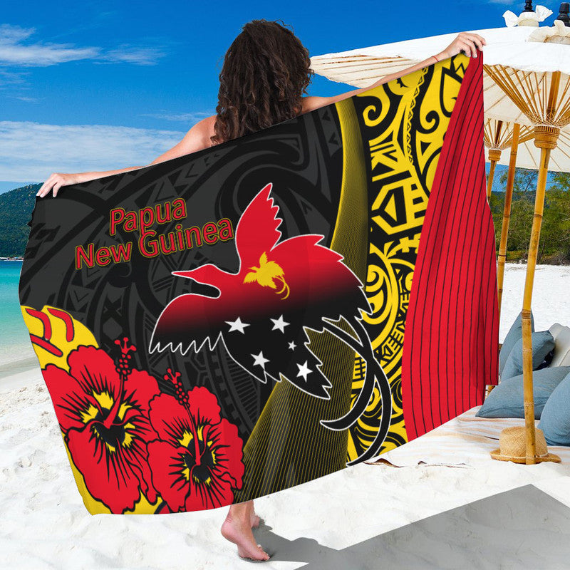 Black Papua New Guinea sarong with red hibiscus flowers, map emblem, and patterned design