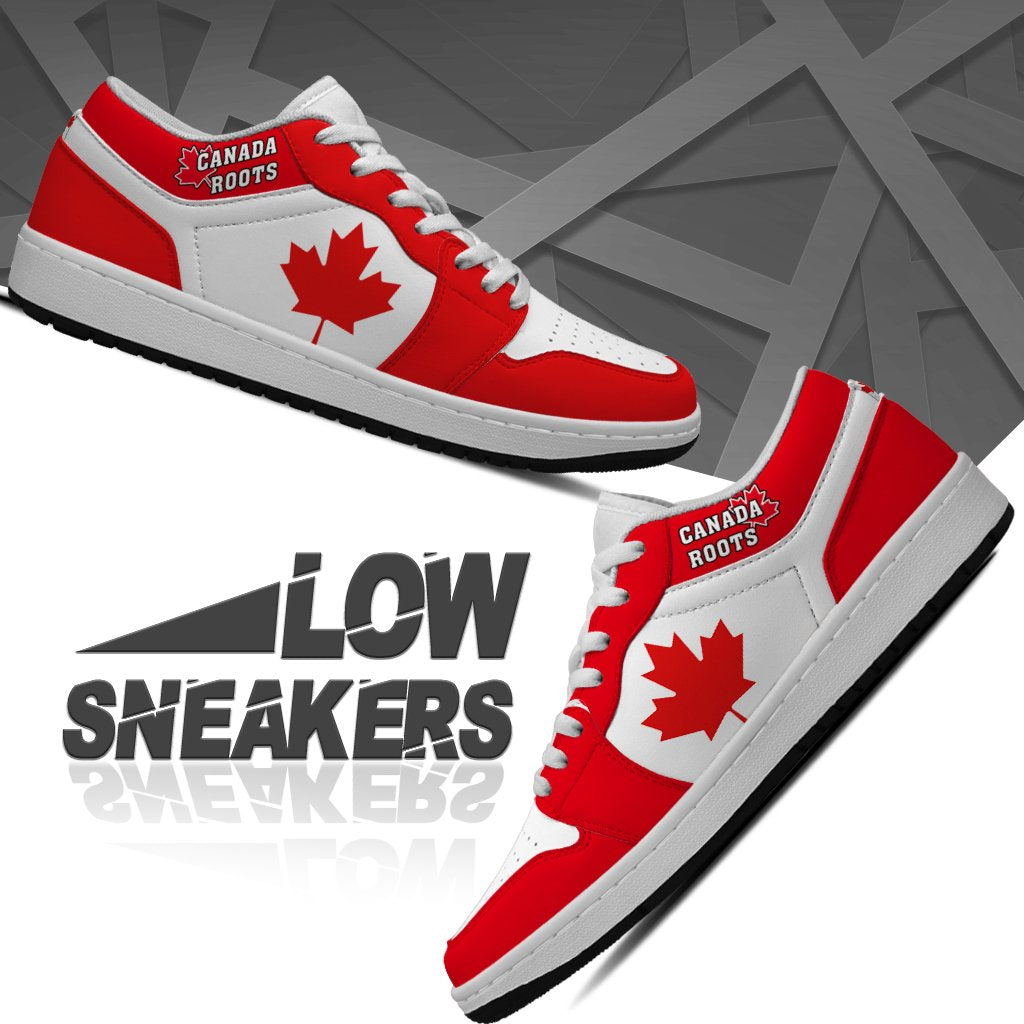 Red and white low-top sneakers, Canada Roots logo on tongue, side maple leaf