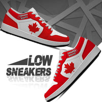 Red and white low-top sneakers, Canada Roots logo on tongue, side maple leaf