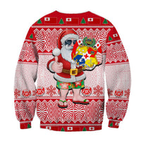 Red Christmas sweatshirt with Santa holding shield graphic and fair-isle snowflake pattern.