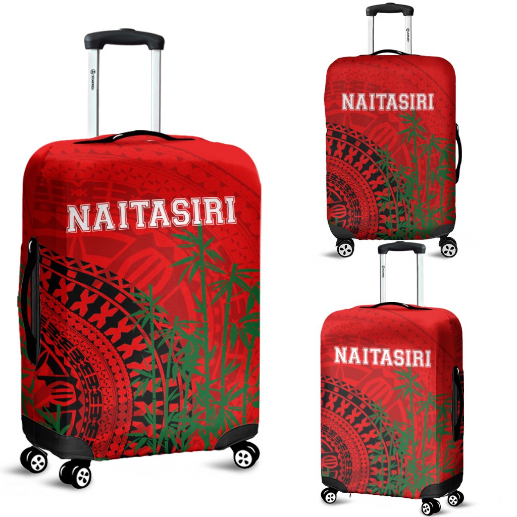 Red luggage cover with tapa pattern, NAITASIRI text, wheels and handle cutouts