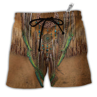 Brown Hawaiian shorts with fringe, dreamcatcher graphic, green trim, drawstring waist