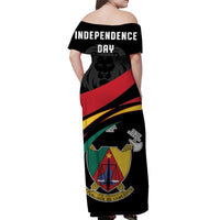 Black off-shoulder long dress, back text 'INDEPENDENCE DAY' and Cameroon badge