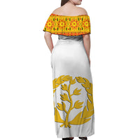 White long dress with off-shoulder back yoke in red/gold pattern and gold tree print