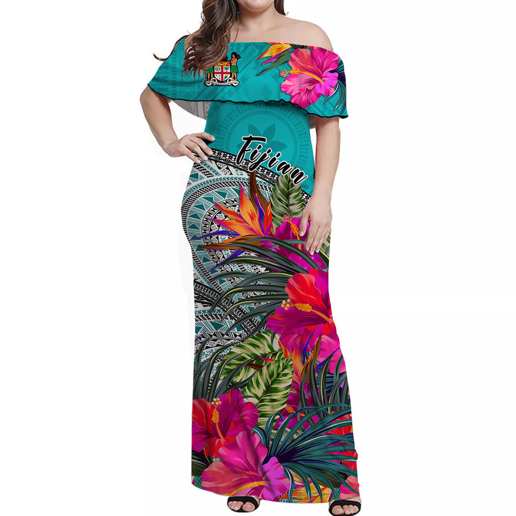 Off-shoulder long dress in green with hibiscus print and Fijian tapa-style pattern