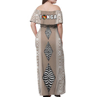 Back view cream off-shoulder long dress with Tonga text and geometric panel print