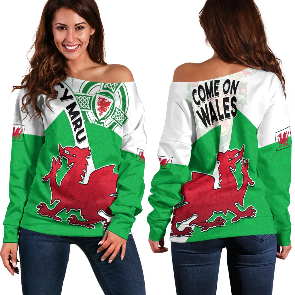 Women’s off-shoulder sweater, green-and-white with red dragon and Celtic knot graphic