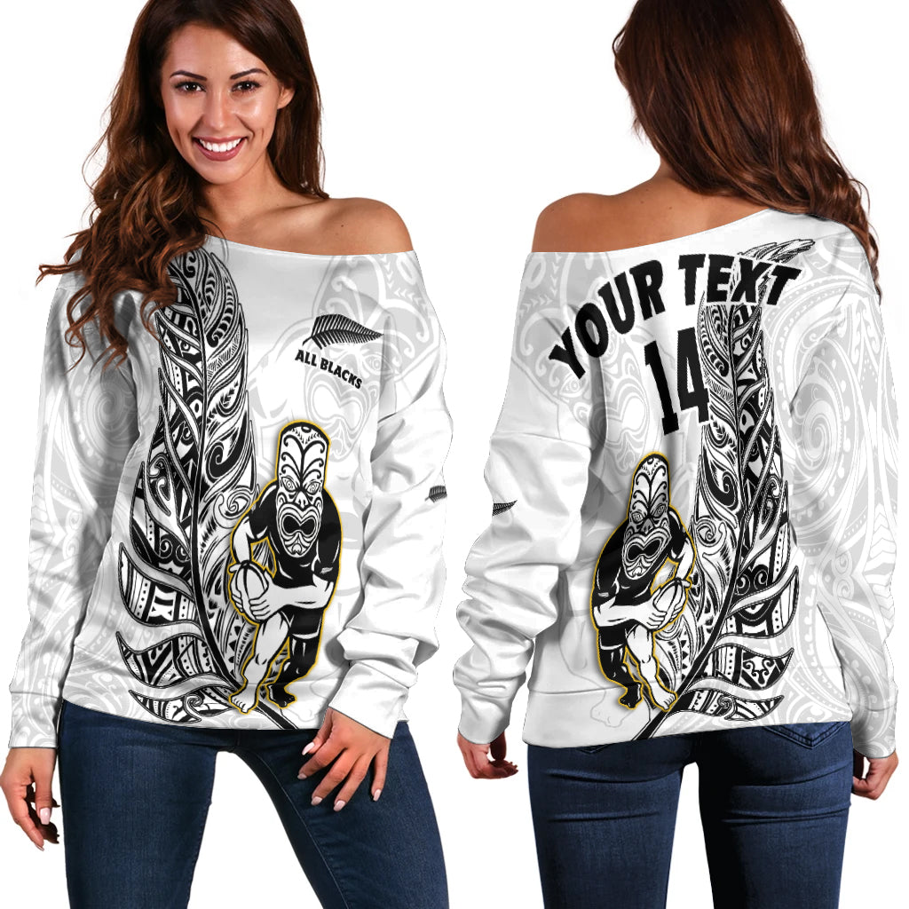 White off-shoulder rugby sweater with black Maori-style artwork and number 14