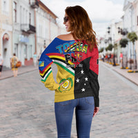 Off-shoulder sweater with TORBA PNG back graphic, stars and yellow panel, long sleeves
