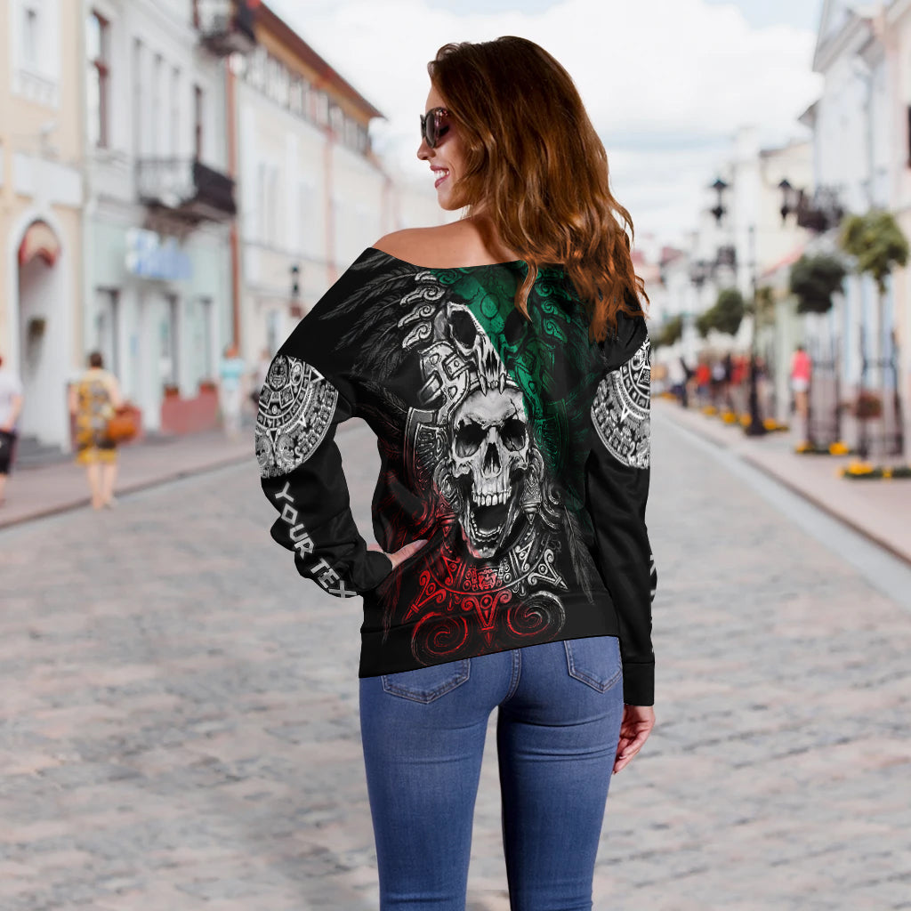 Black off-shoulder sweater with large skull graphic and green-red details, long sleeves
