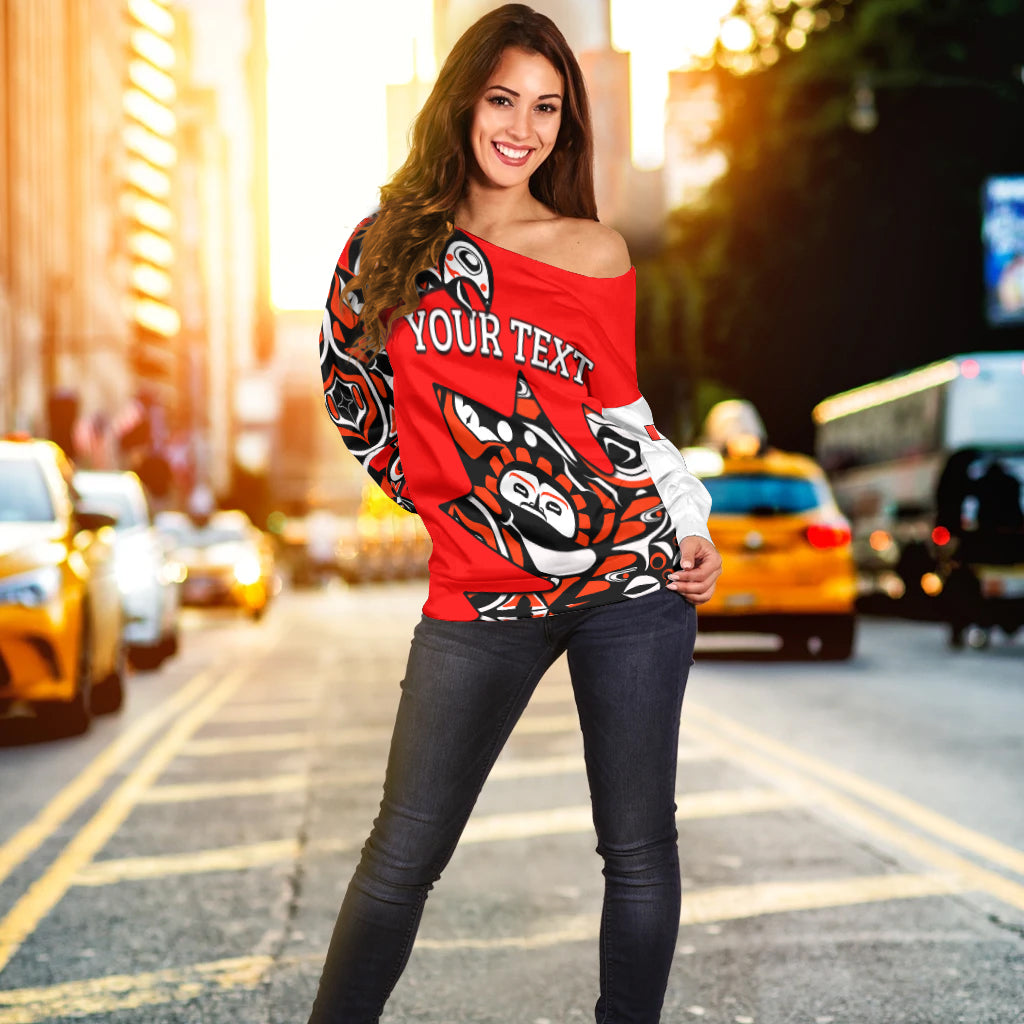 Red off-shoulder sweater with YOUR TEXT graphic and black-white tribal pattern