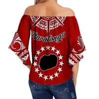 Red off-shoulder wrap top with Rarotonga text, star wreath, and turtle graphic
