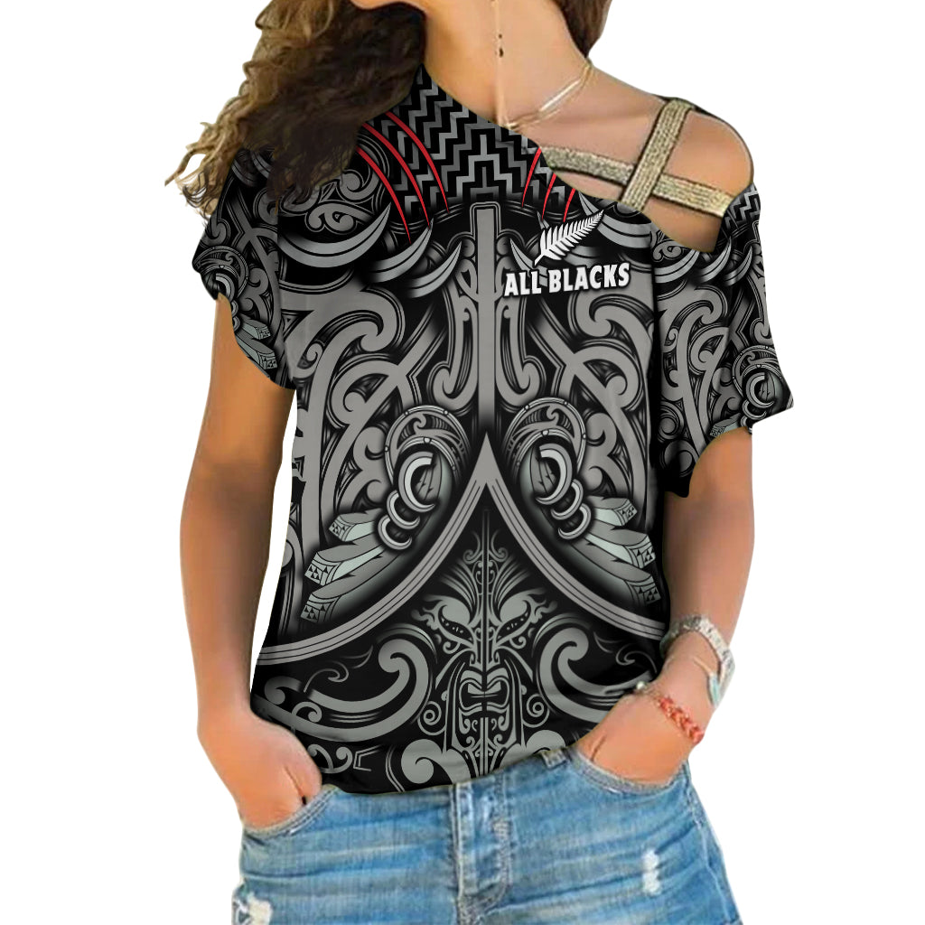 Women’s black off-shoulder rugby shirt with All Blacks text and Maori-style pattern