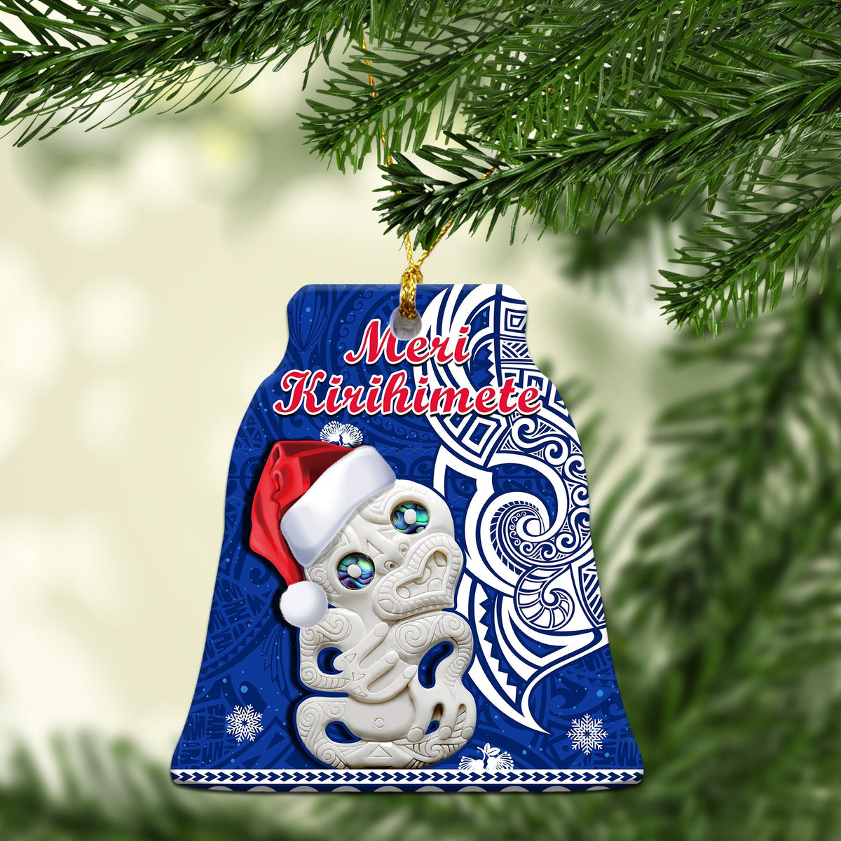 Blue ceramic bell ornament with hei tiki Santa hat, Merry Kirihimete text