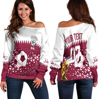 Off-shoulder sweater with maroon World Cup graphic, front and back views
