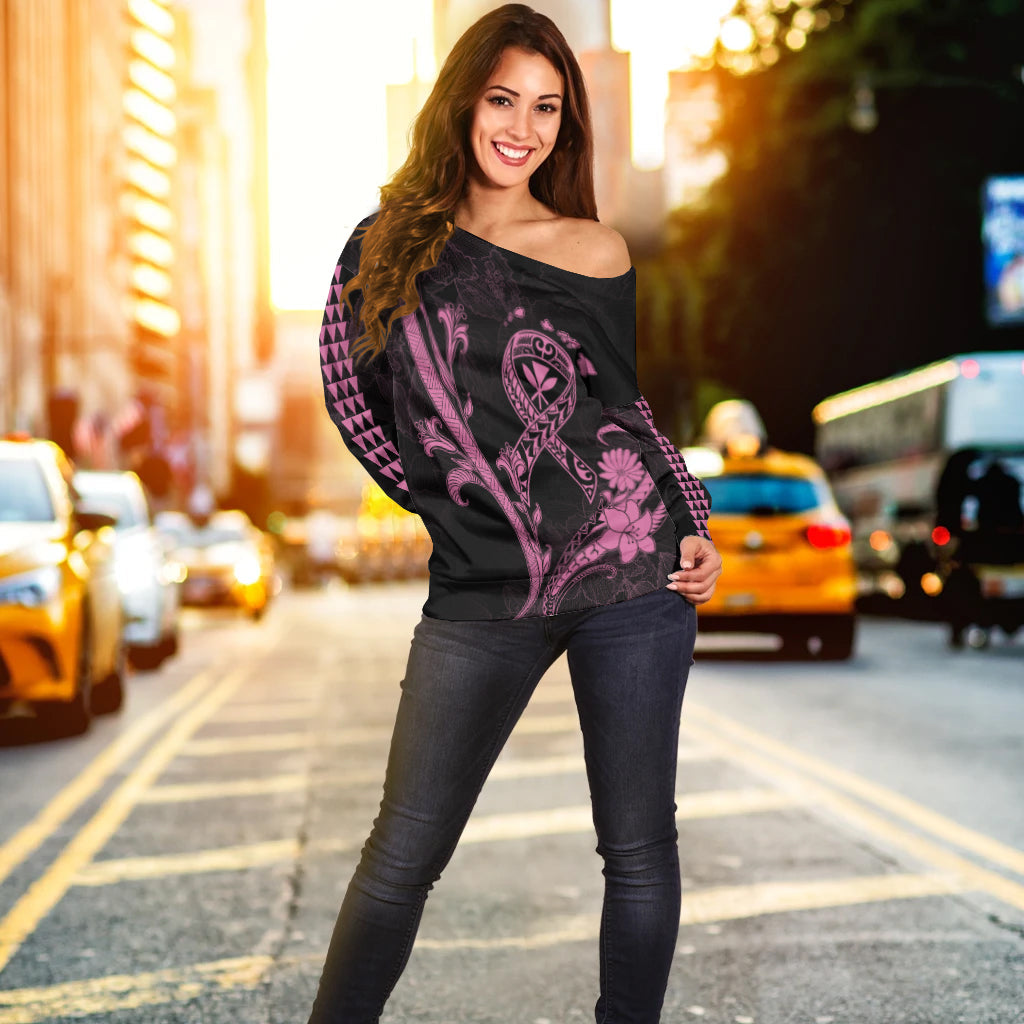 Black off-shoulder sweater with pink tribal breast cancer graphic and long sleeves