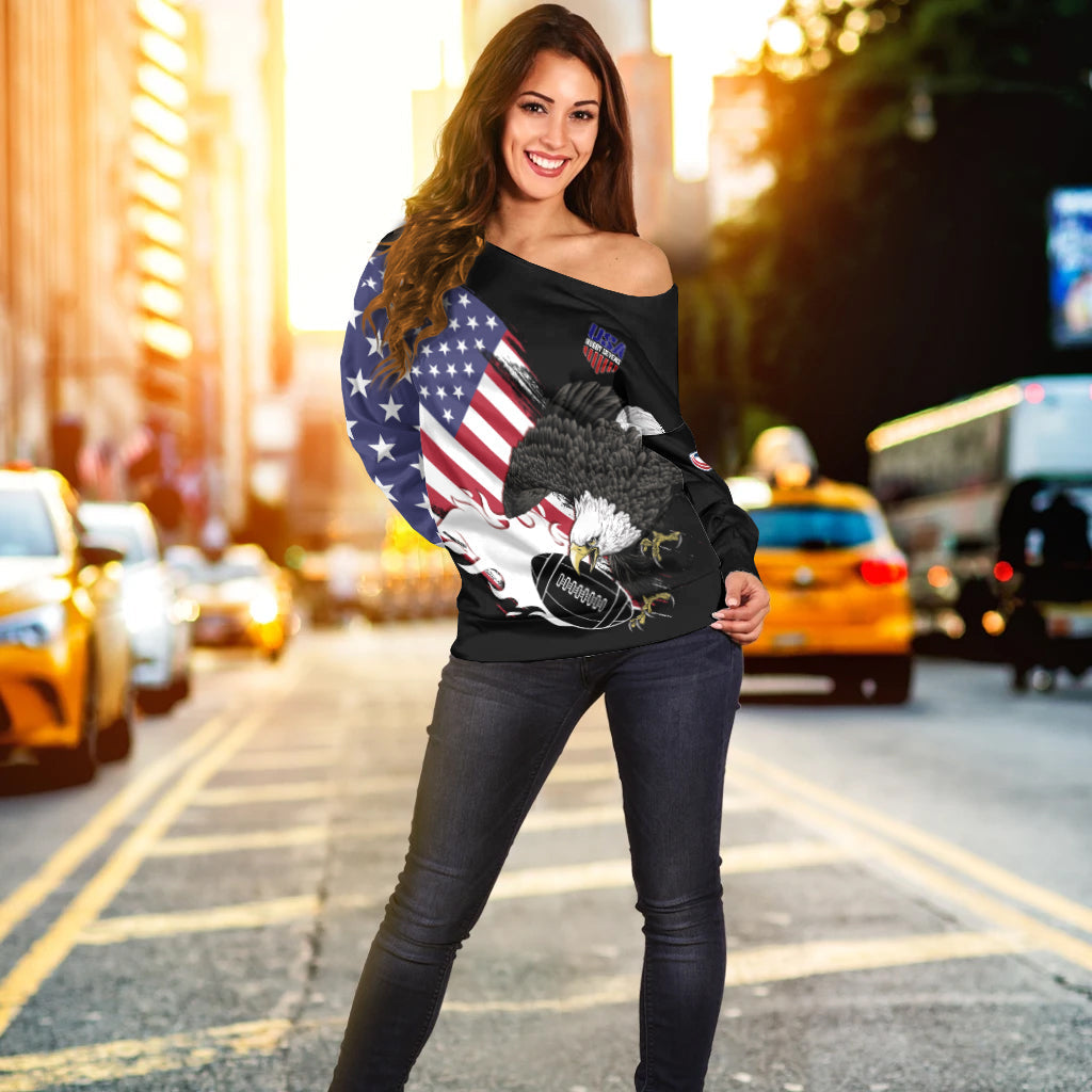 Black off-shoulder sweater with centered eagle and flag print, wide neckline