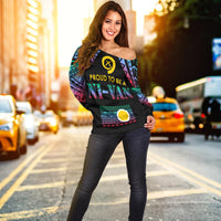 Women’s off-shoulder sweater in black with bright Polynesian pattern and graphic