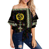 Women’s off-shoulder waist wrap top in black with Eritrean tile cross pattern