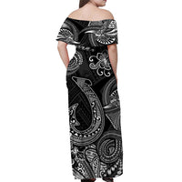 Back view women’s off-shoulder maxi dress, black with white tribal fishhook motifs