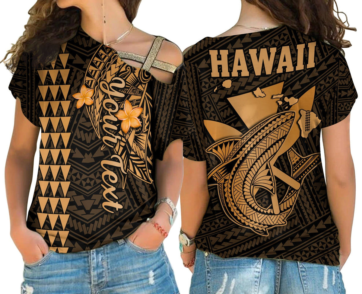 Gold patterned cross-shoulder shirt with Hawaiian tribal face art and ‘HAWAII’ text back
