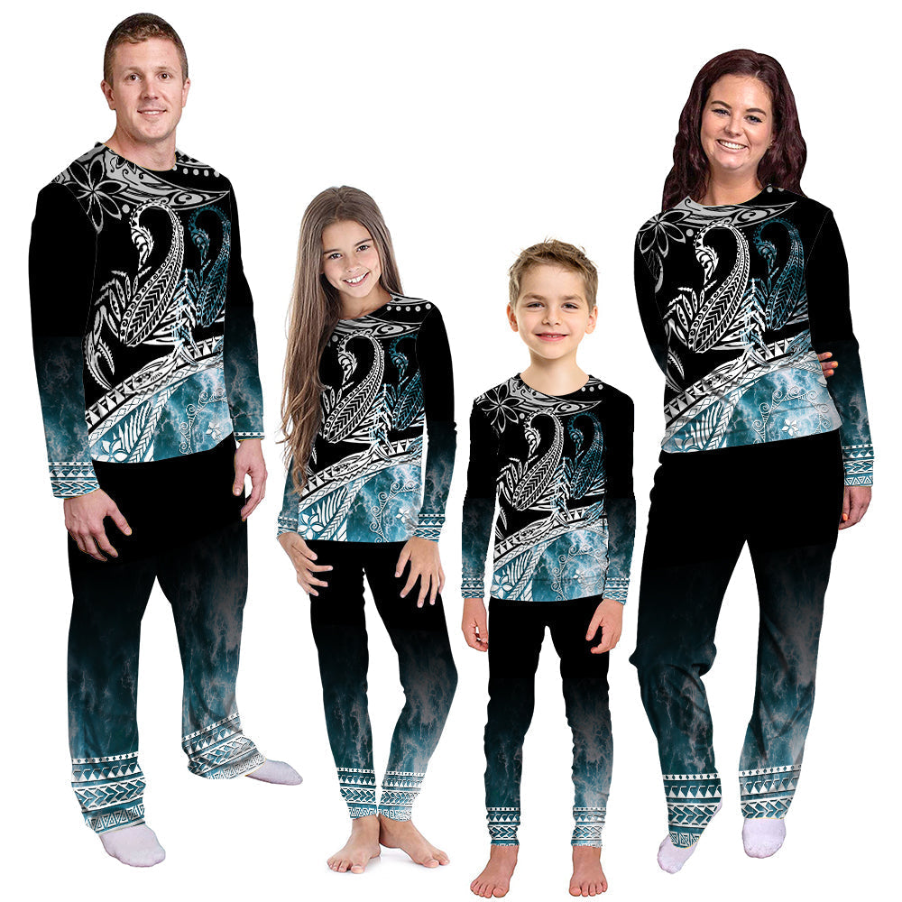 Long-sleeve pajama set: black top with teal ocean-wave print and matching pants