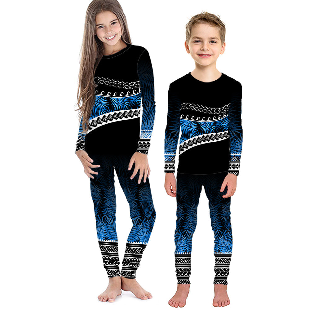 Kids long-sleeve pajama set with black top and blue tropical palm pattern pants