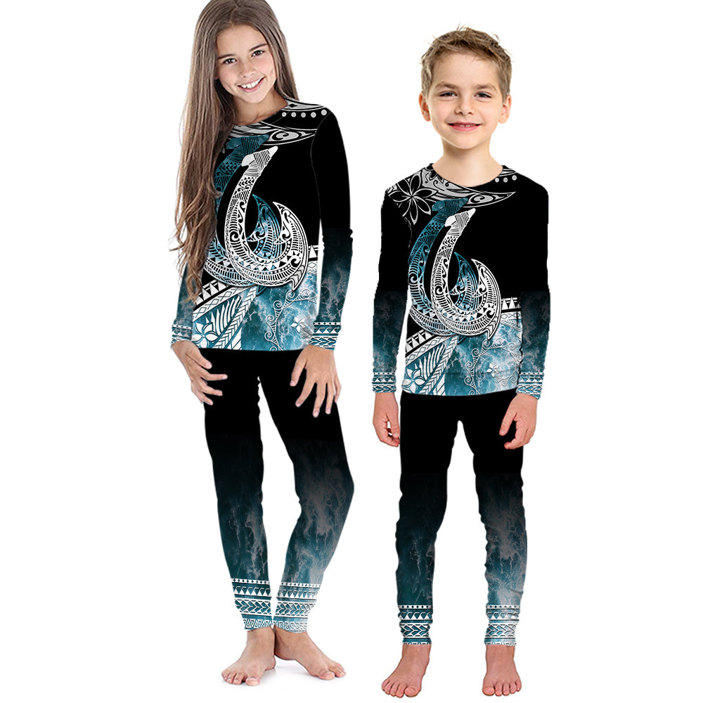 Kids black pajama set with turquoise ocean wave print, long-sleeve top and leggings
