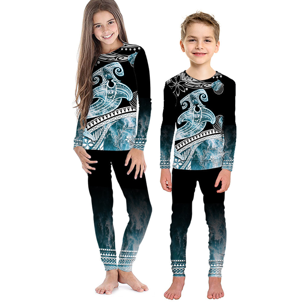 Kids' black pajama set with turquoise shark wave graphic, long sleeves and pants