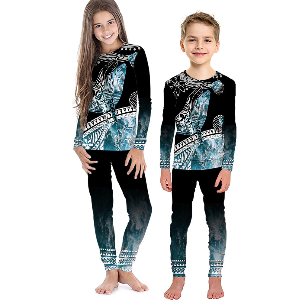 Kids black long-sleeve pajama set with teal ocean waves and whale graphic, matching pants