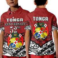 Two kids wearing red Tonga polo shirts: front text logo and back crest design