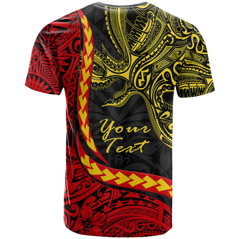 Black T-shirt with red and yellow tribal wave stripe and central script text