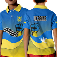 Kid blue Ukraine polo shirt with yellow collar, trident crest and 'UKRAINE' front graphic