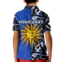Blue kids polo shirt back with “YOUR TEXT” and sun emblem graphic