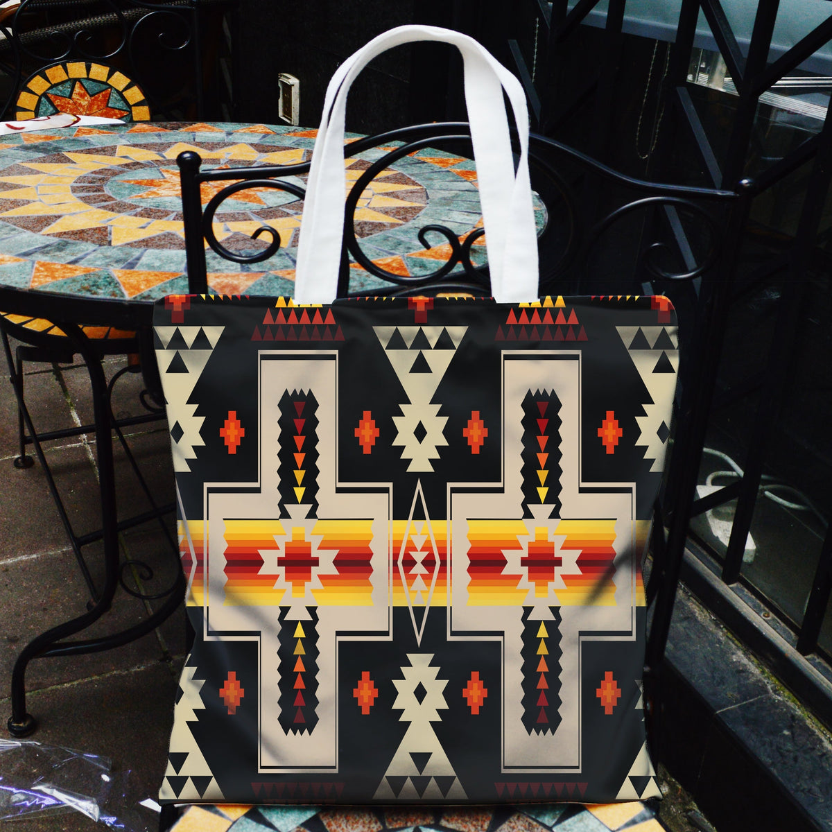 Multicolor Native American geometric canvas tote bag with front pocket and white handles
