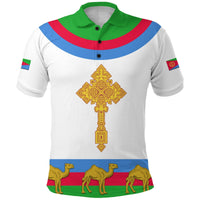 White polo shirt with green collar and buttons, gold cross design, camel graphic hem