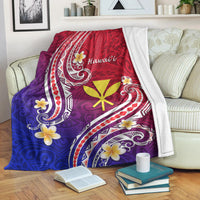 Hawaiian blanket gradient purple-to-blue with red accents, white patterns, and yellow flower center